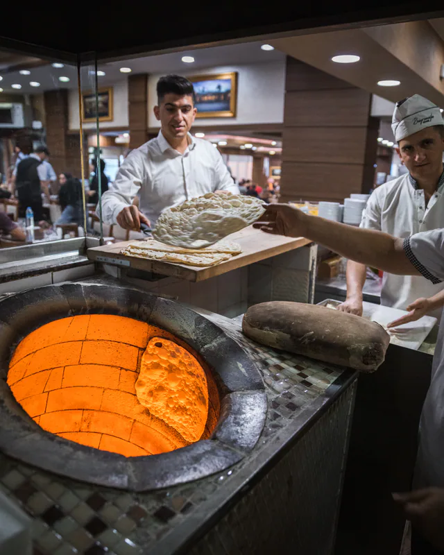 Flatbreads coming out of the oven at Bayramoğlu Döner in Kavacık, photographed in September 2019.