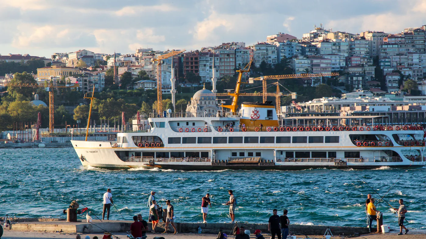 A Bosphorus ferry passing below the hillside buildings of Cihangir in Istanbul